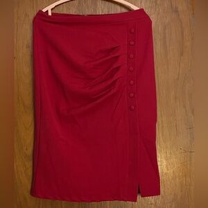 Red pencil skirt with ruching and covered buttons.